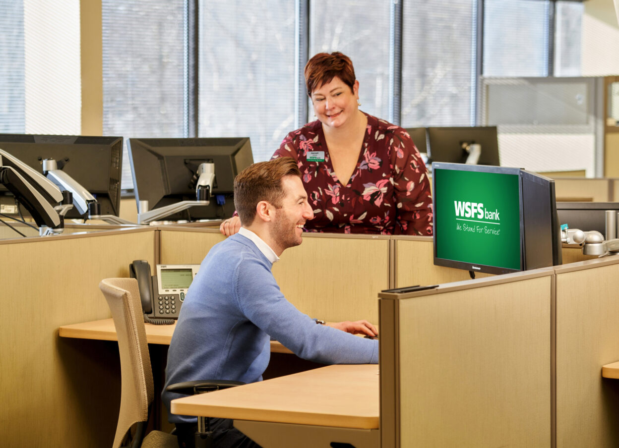 Two WSFS Associates at their desks.