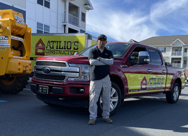 Man standing in front of truck