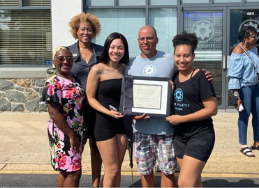 Greg and Ayanna Wright, owners of Club Pilates Pike Creek in Wilmington, Delaware, celebrating the opening with others.