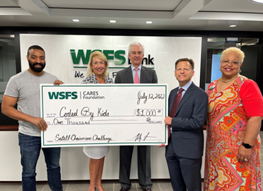 WSFS Associates present a giant check for $1,000 to Coded by Kids.
