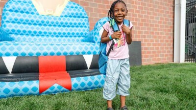 A girl with a backpack.
