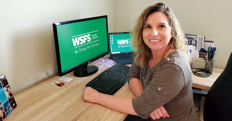 A WSFS Associate at her desk.