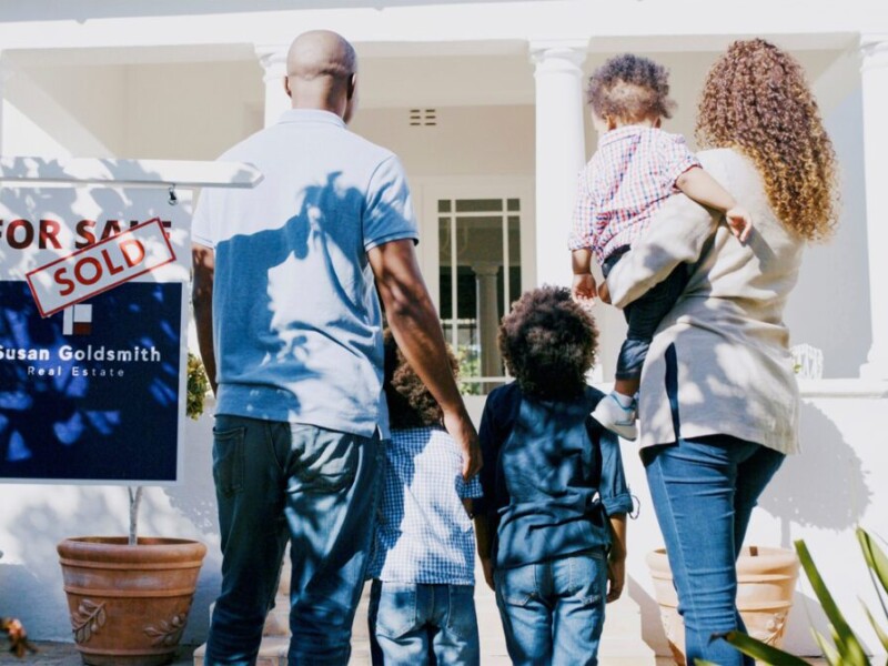 Family in front of new home.