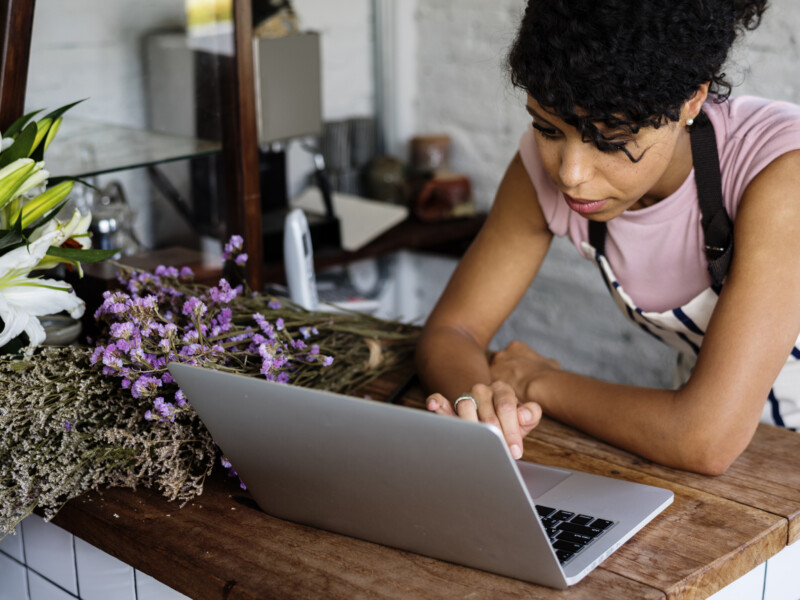 Woman using laptop.