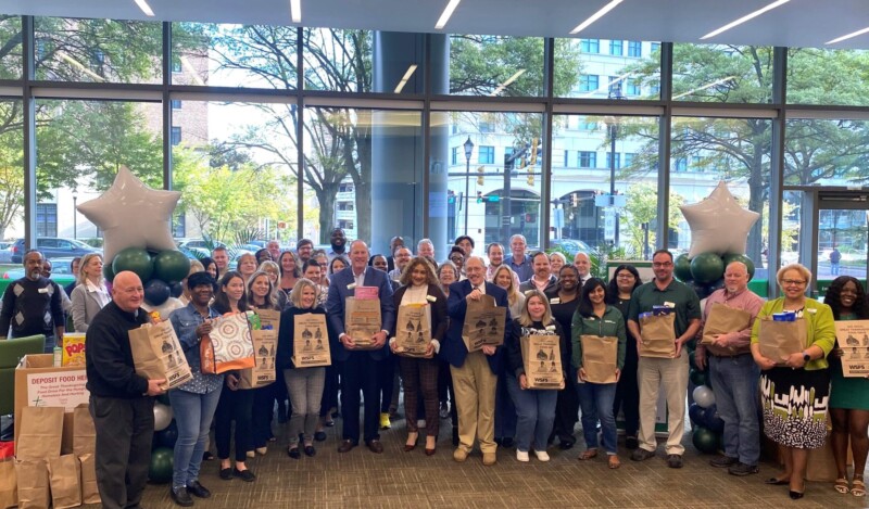 WSFS Associates holding donated food.