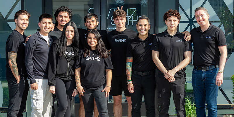 Rico Macaraeg, Steven Schnelle, and team celebrate StriveWell's second SWTHZ location opening.