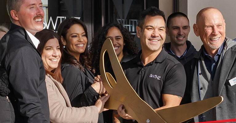 StriveWell co-founders Rico Macaraeg and Steven Schnelle cut the ribbon on their first SWTHZ location in New Jersey.