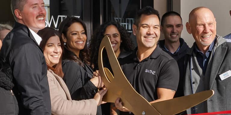 StriveWell co-founders Rico Macaraeg and Steven Schnelle cut the ribbon on their first SWTHZ location in New Jersey.