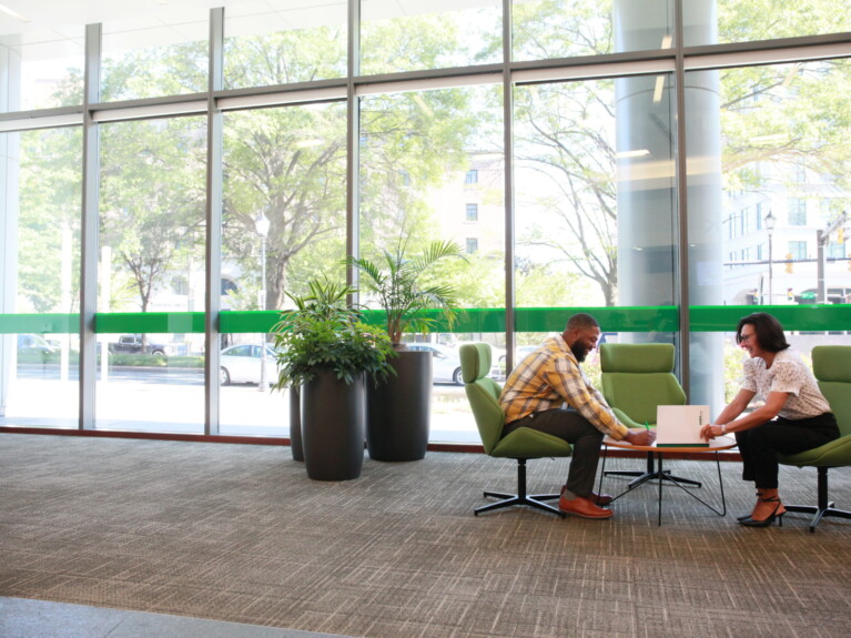 A customer signing a document with a WSFS personal banker.