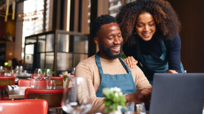 Small Business team working together on the computer.