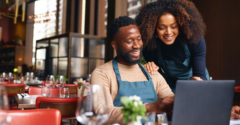 Small Business team working together on the computer.