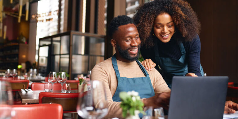 Small Business team working together on the computer.