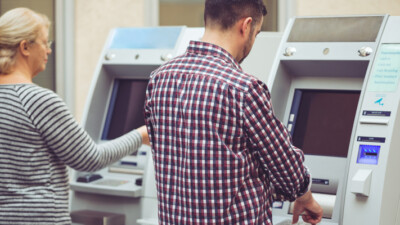 Customers using ATMs.