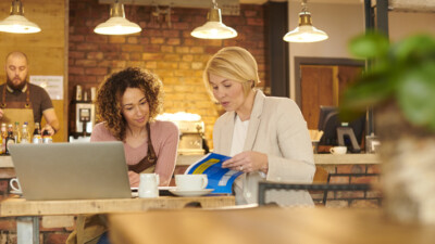 A business owner and a banker reviewing information.