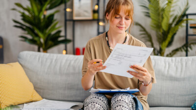 A young woman reviewing her finances.