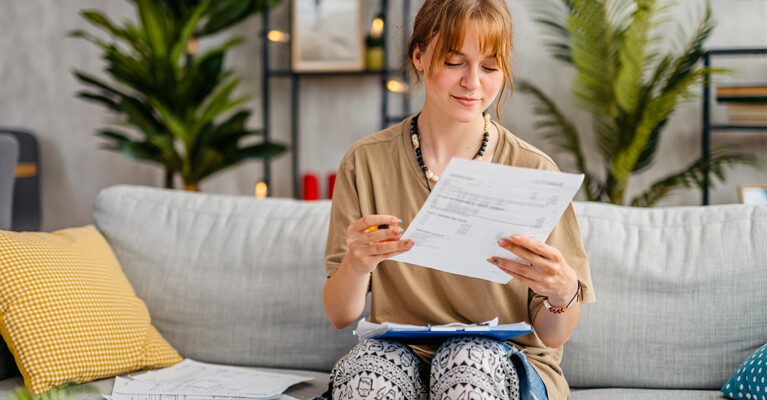 A young woman reviewing her finances.