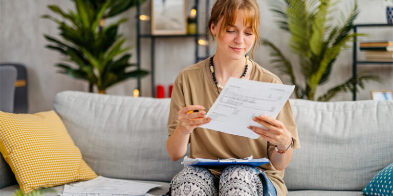 A young woman reviewing her finances.