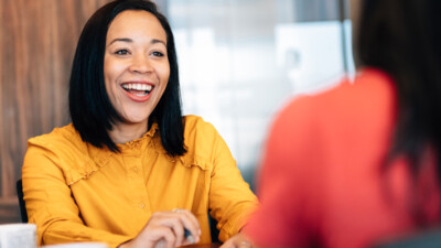 An excited woman, smiling.