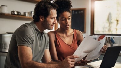 Man and woman reviewing paperwork.