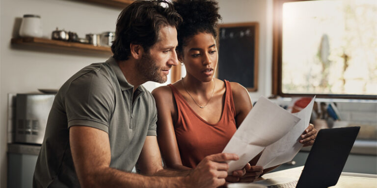 Man and woman reviewing paperwork.