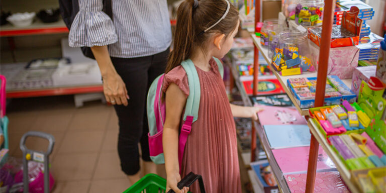 A student looking at school supplies.