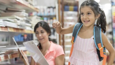 Woman and child shopping for school supplies.