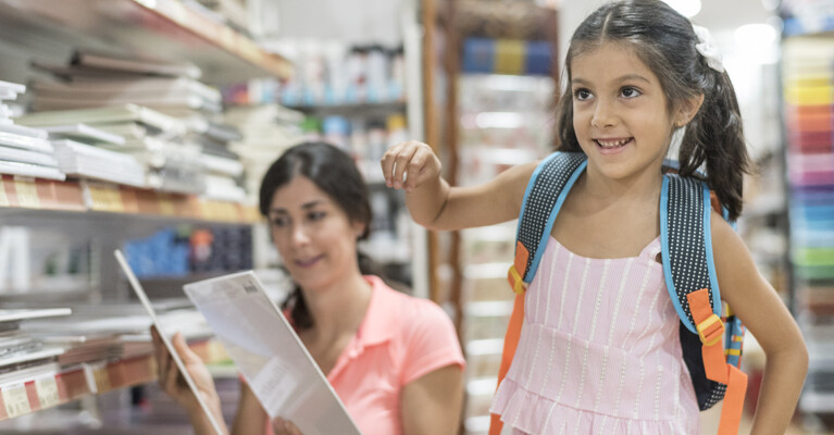 Woman and child shopping for school supplies.