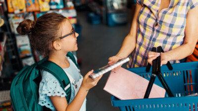 A student shopping with their parent.