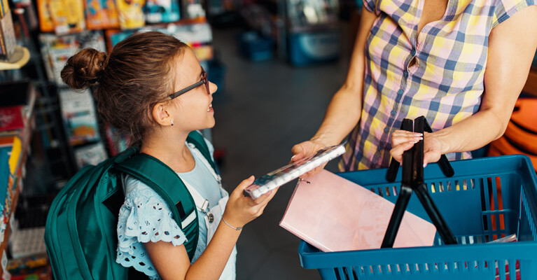 A student shopping with their parent.