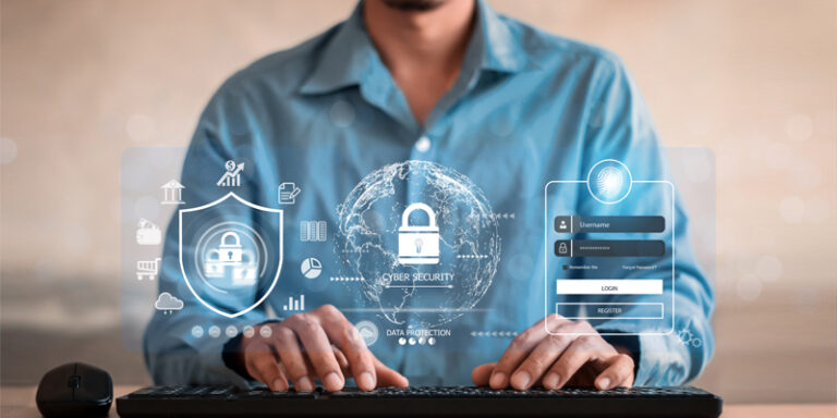 A person at a laptop with cybersecurity images.