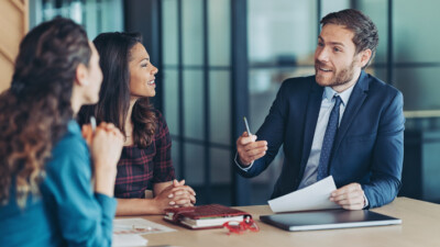 Business owners discussing their finances with their banker.