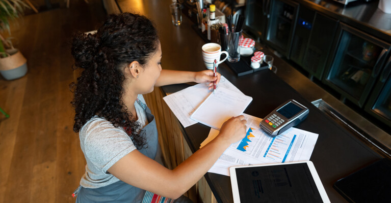 A small business owner working on paperwork.