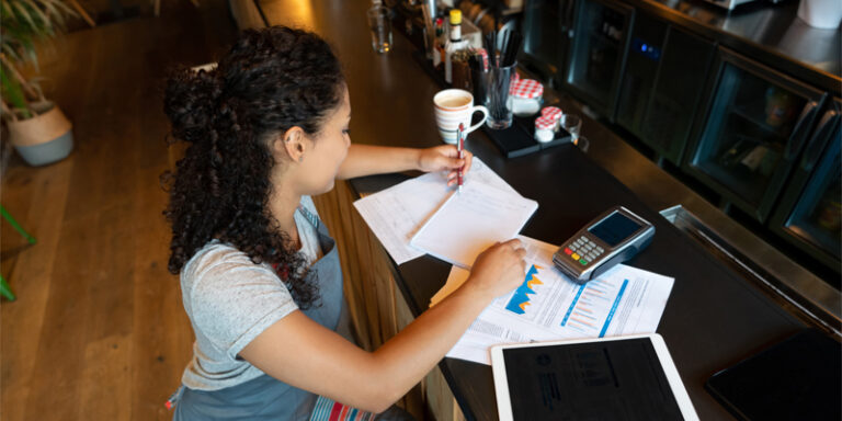 A small business owner working on paperwork.