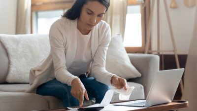 A woman reviewing receipts and her finances.