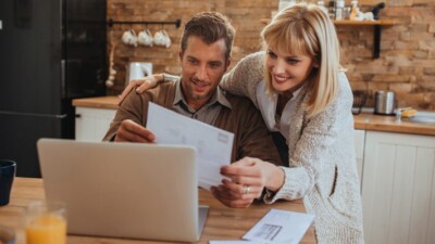 Man and woman looking at paperwork.