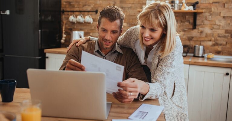 Man and woman looking at paperwork.