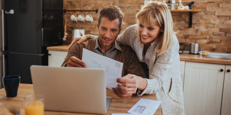 Man and woman looking at paperwork.