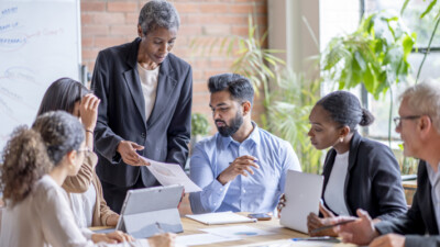 A diverse group of business professionals in a meeting.