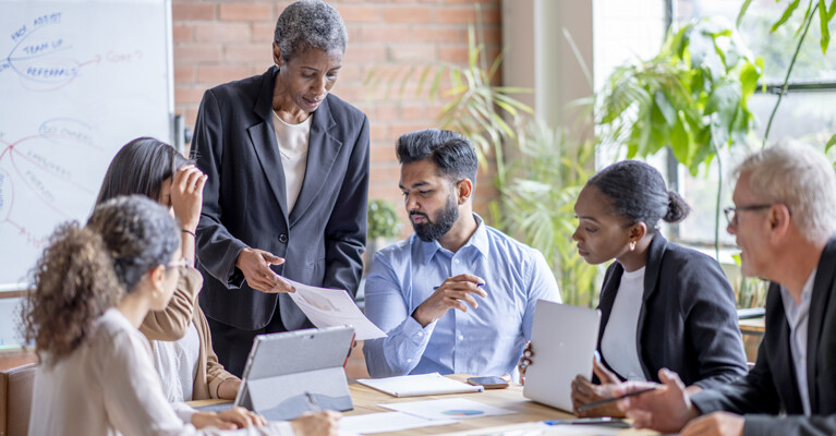 A diverse group of business professionals in a meeting.