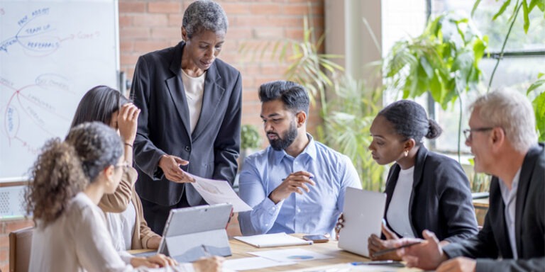 A diverse group of business professionals in a meeting.