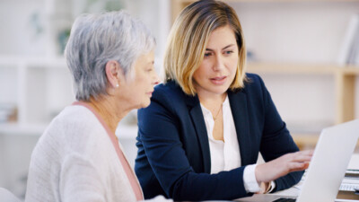 A financial advisor going over paperwork with a customer.