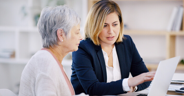 A financial advisor going over paperwork with a customer.