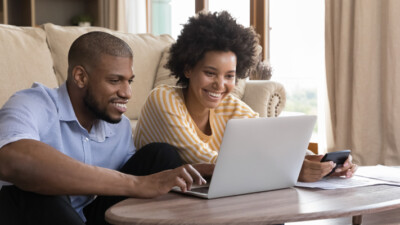 Couple looking at computer together