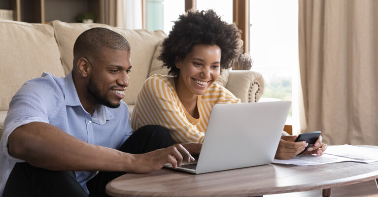 Couple looking at computer together