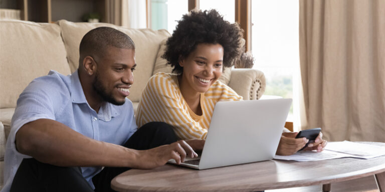 Couple looking at computer together