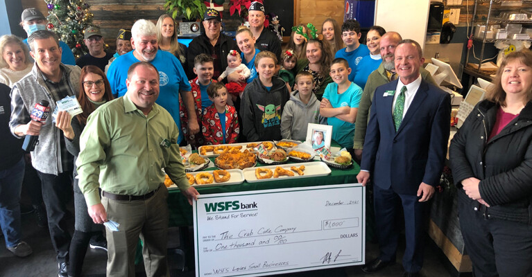 The Crab Cake Company with WSFS Bank prop check for $1000.