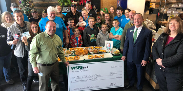 The Crab Cake Company with WSFS Bank prop check for $1000.
