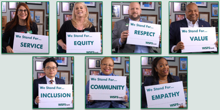 Various WSFS Associates holding signs to emphasize the company's DEI efforts. We Stand For...Service. We Stand For...Equity. We Stand For...Respect. We Stand For...Value. We Stand For...Inclusion. We Stand For...Community. We Stand For...Empathy.