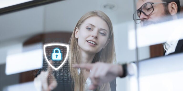 Woman and man pointing at digital protection icon and code.