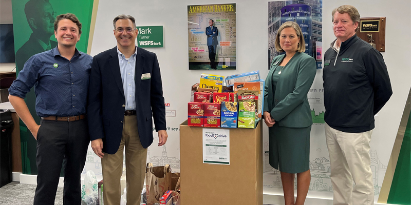 WSFS Associates gather with employees from Sharing Excess to kick off the annual Food Drive.